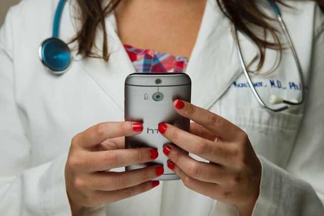 Doctor offering telephone consultation on a smartphone device